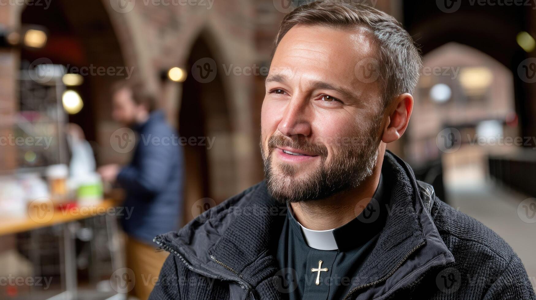 A man with a beard and a priest's collar photo