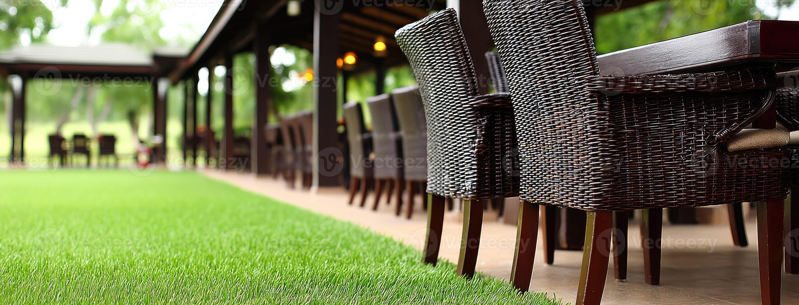 A row of chairs and tables in a restaurant photo