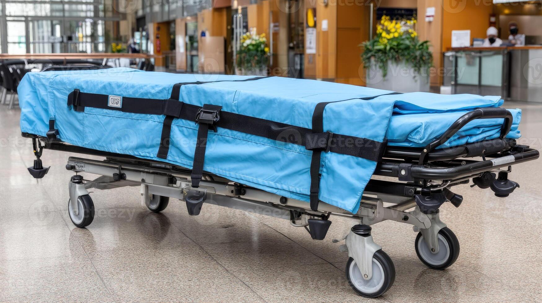 A blue stretcher with wheels and a blue cover photo