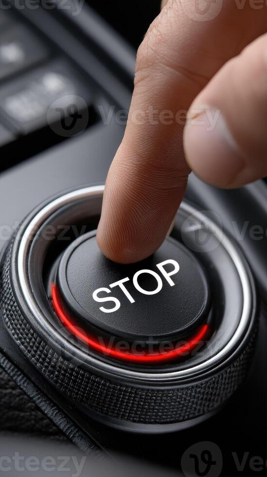 A person pressing a stop button on a car photo