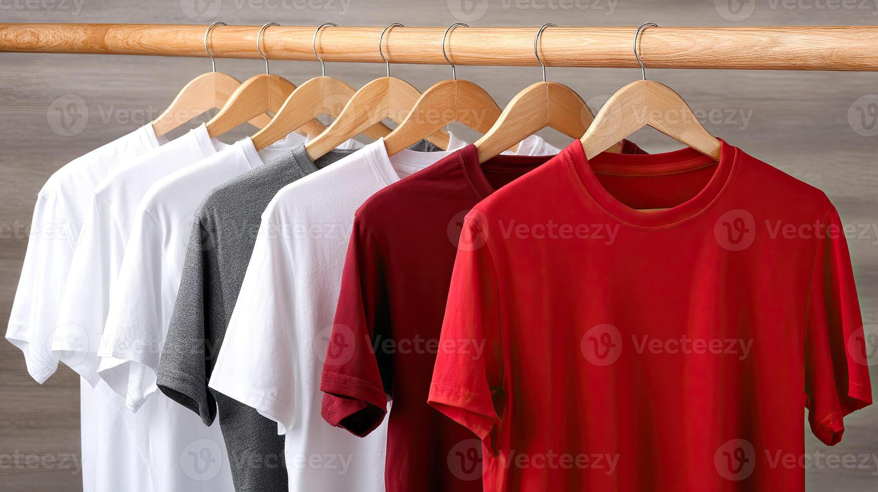 A group of shirts hanging on a wooden rack photo