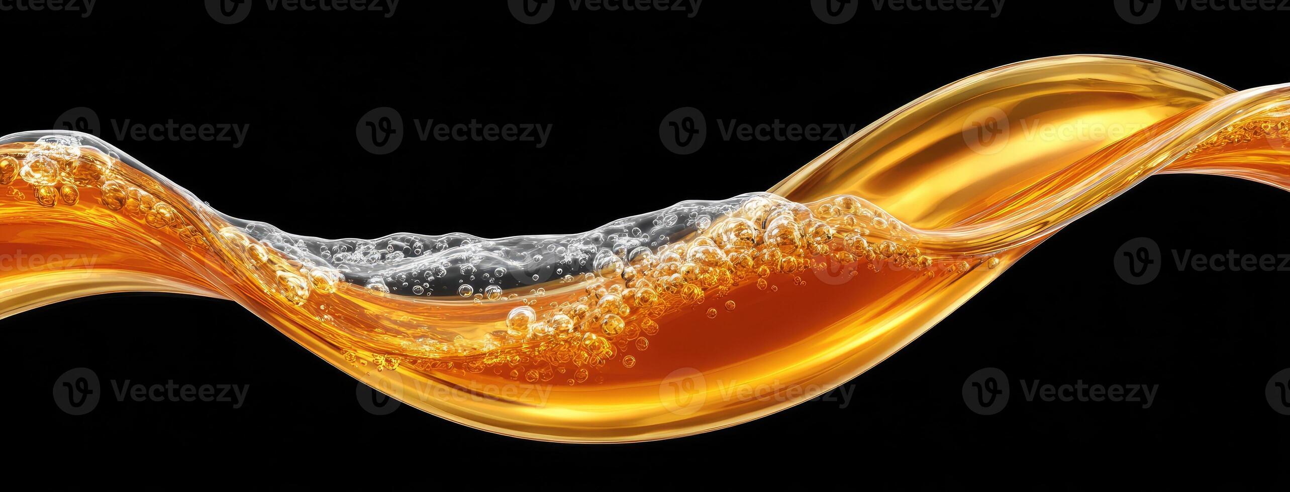 Orange liquid flowing over a black background photo