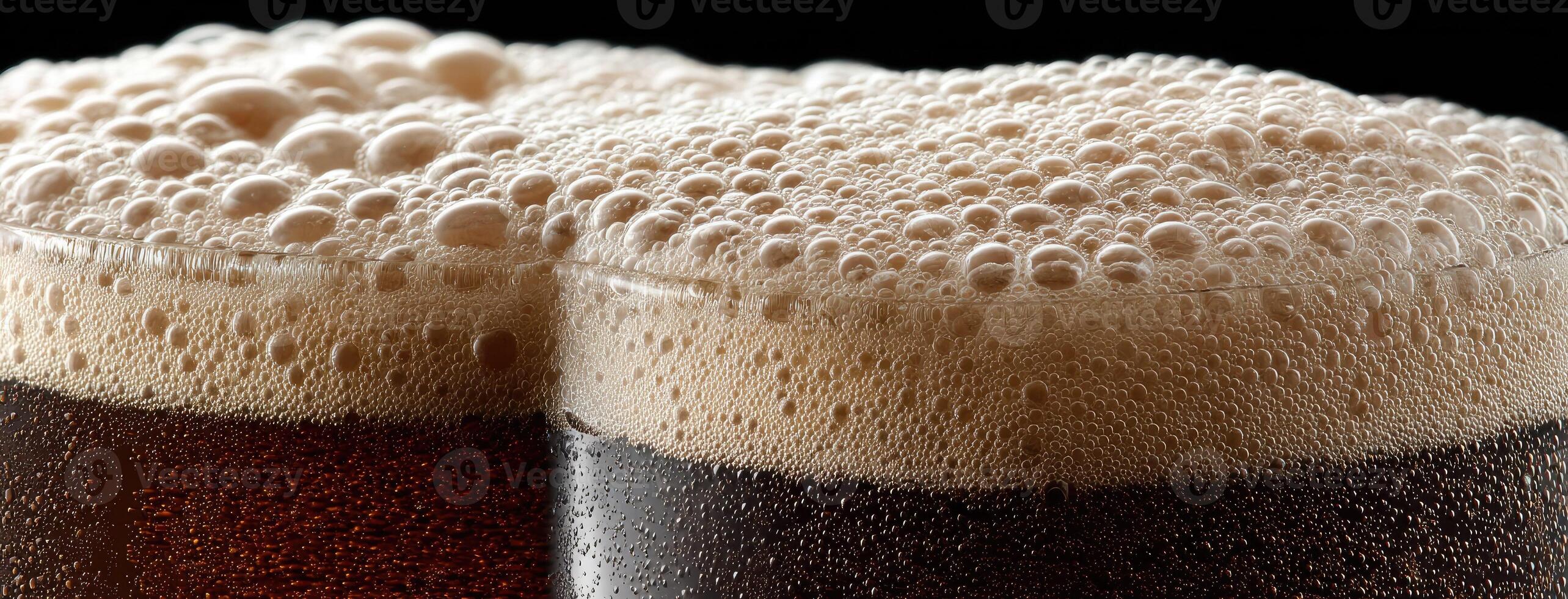 Two glasses of beer with foam on top photo