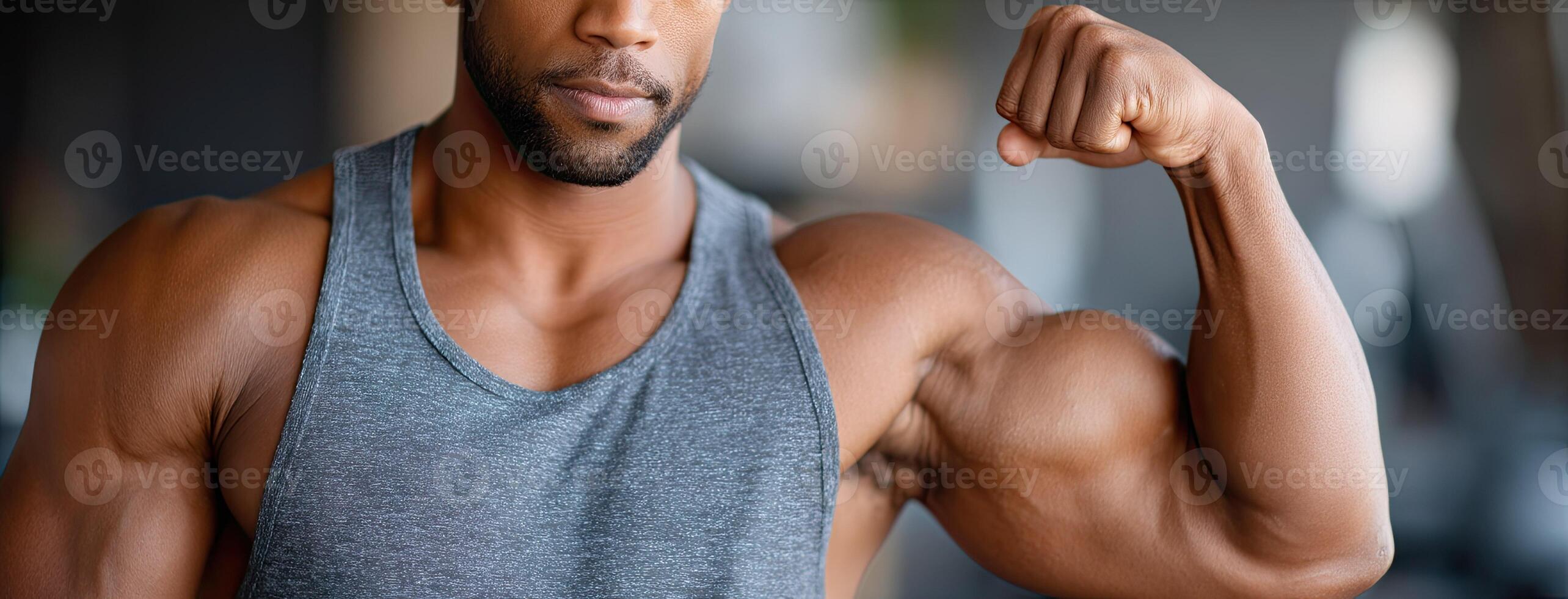 A man flexing his muscles in the gym photo