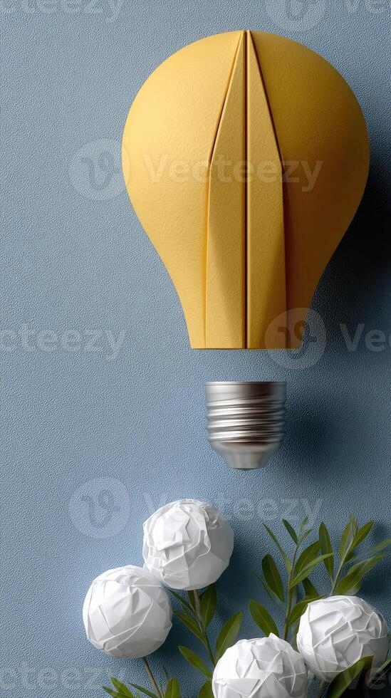 A yellow light bulb with white paper flowers photo