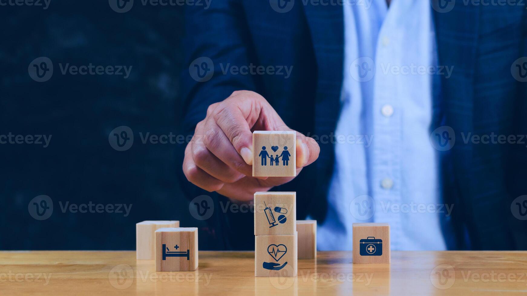 Health Insurance and medical care concept, wooden blocks displaying health related icons, medical care, health insurance, medication. healthcare services, protection, insurance coverage. photo