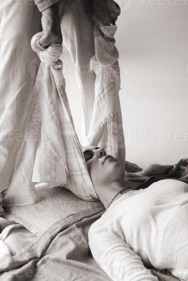 Wellness session with gentle stretching and relaxation practices in a serene indoor setting during daylight hours photo