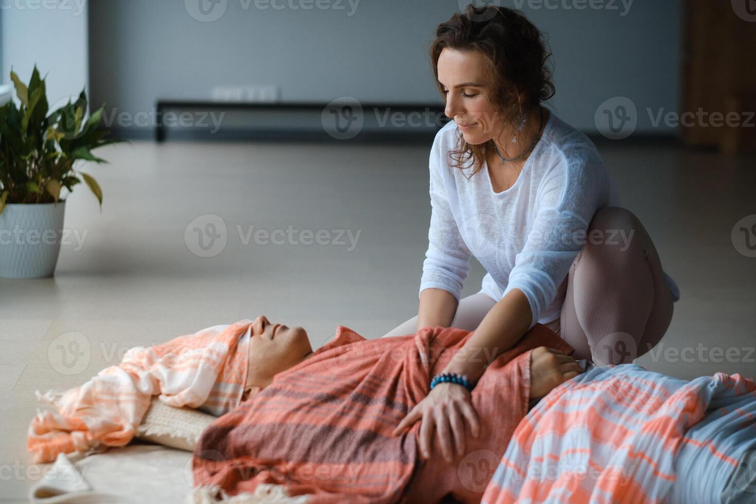 Relaxation and healing through gentle massage in a serene indoor setting during a wellness session.. photo