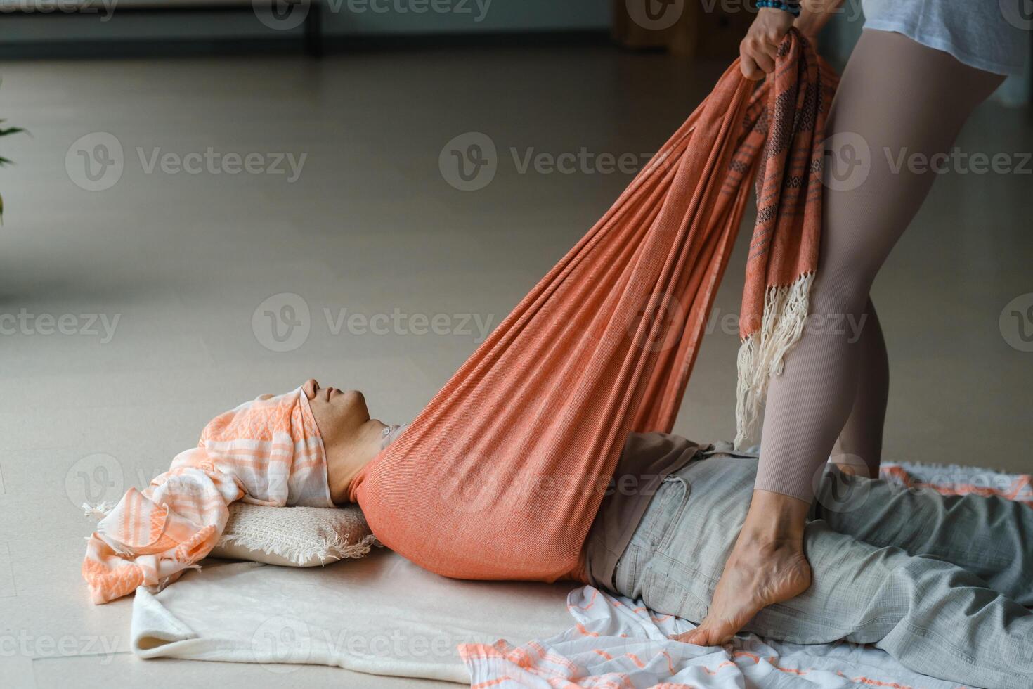 Wellness session for relaxation with guided stretching in a serene studio environment during a calm afternoon photo
