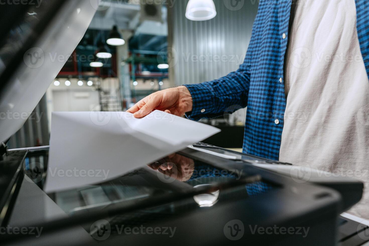 Copying documents in a modern office environment during the day photo