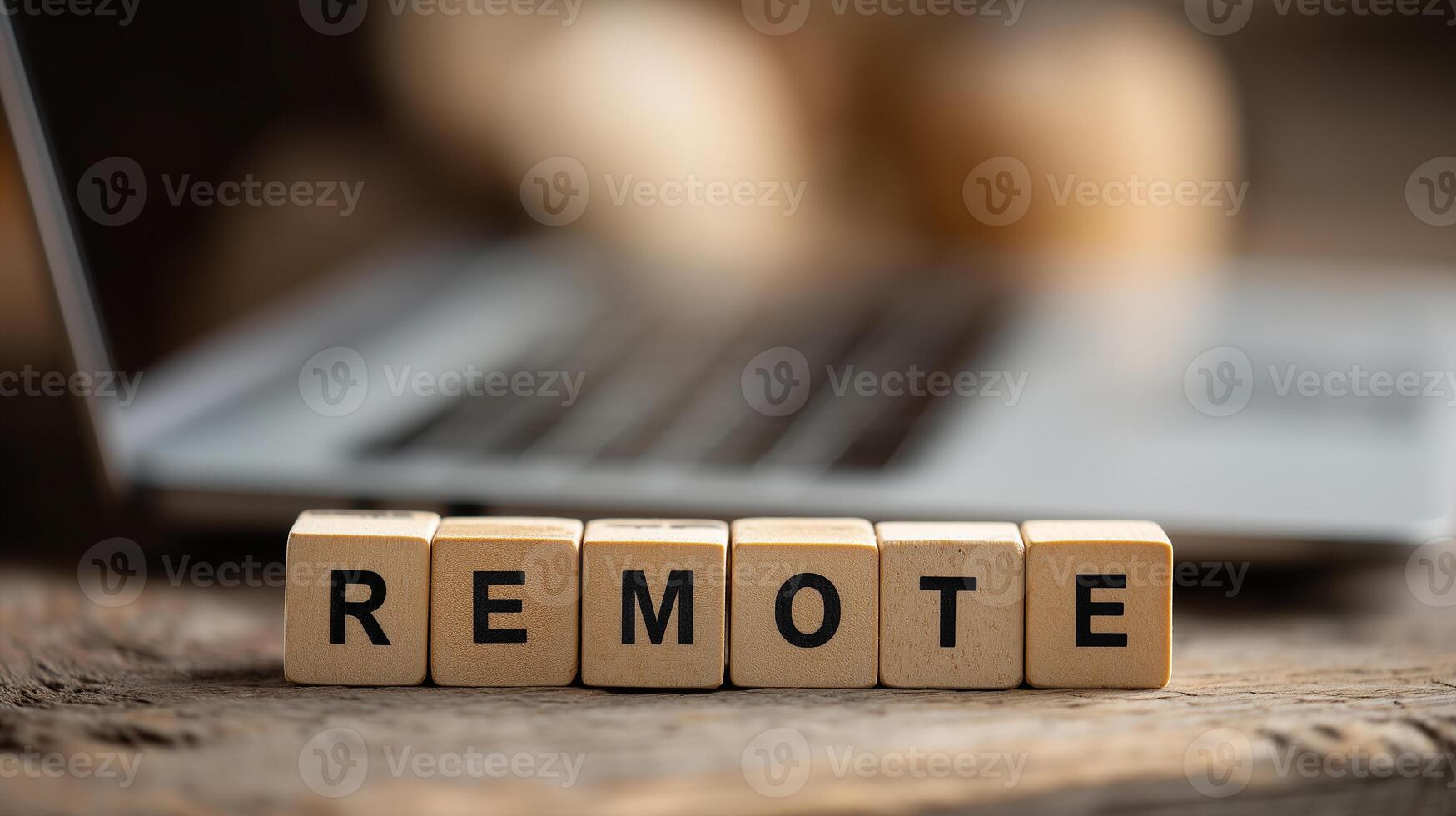 REMOTE written on a Wooden Cubes. Remote Work Solutions for Flexible Employment and Virtual Office Efficiency photo