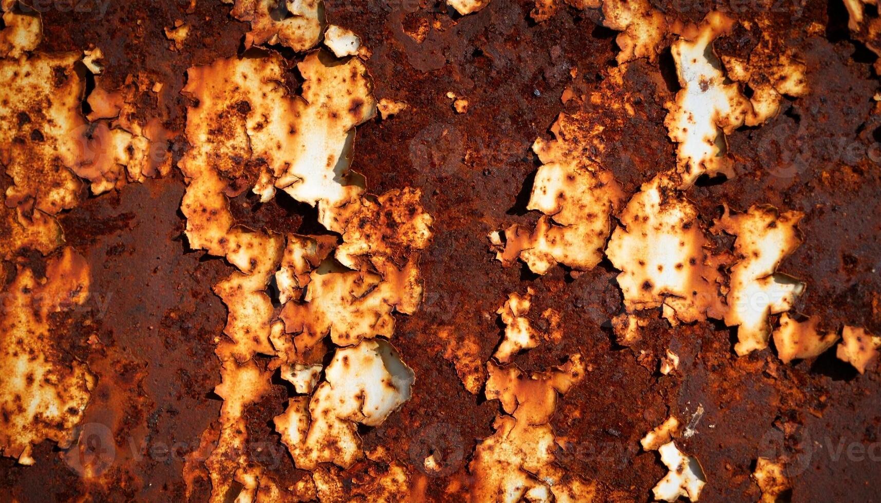 Rusty Metal Surface Showing Significant Corrosion and Peeling Layers in an Industrial Setting photo