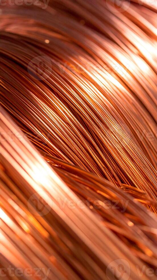 Copper Wires Glisten Under Bright Light Showcasing Intricate Textures and Hues in a Close-Up View photo