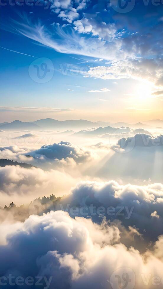 Beautiful Sunrise Over Misty Mountains and Clouds at Dawn Illuminating a Serene Landscape photo