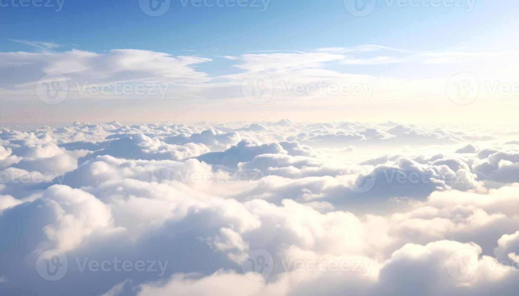 A Breathtaking View of Fluffy Clouds Stretching Across a Clear Blue Sky at Sunrise photo