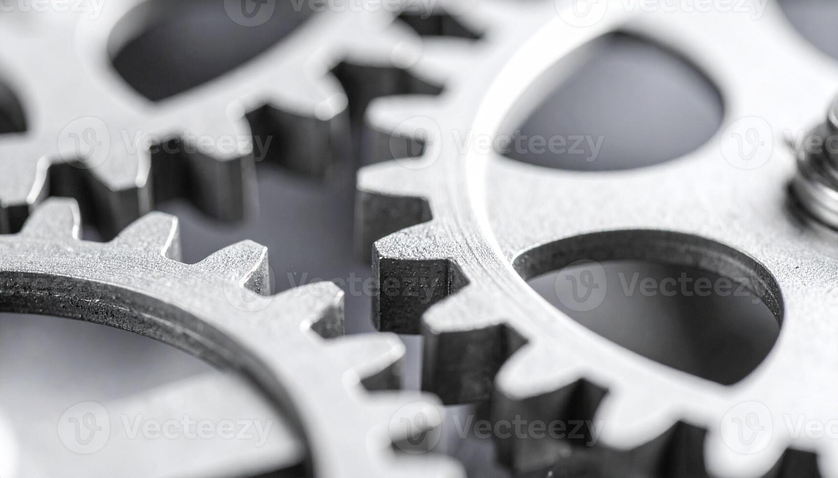 Close-up of Interlocking Metal Gears Showcasing Precision Engineering and Mechanical Design in Industrial Setting photo