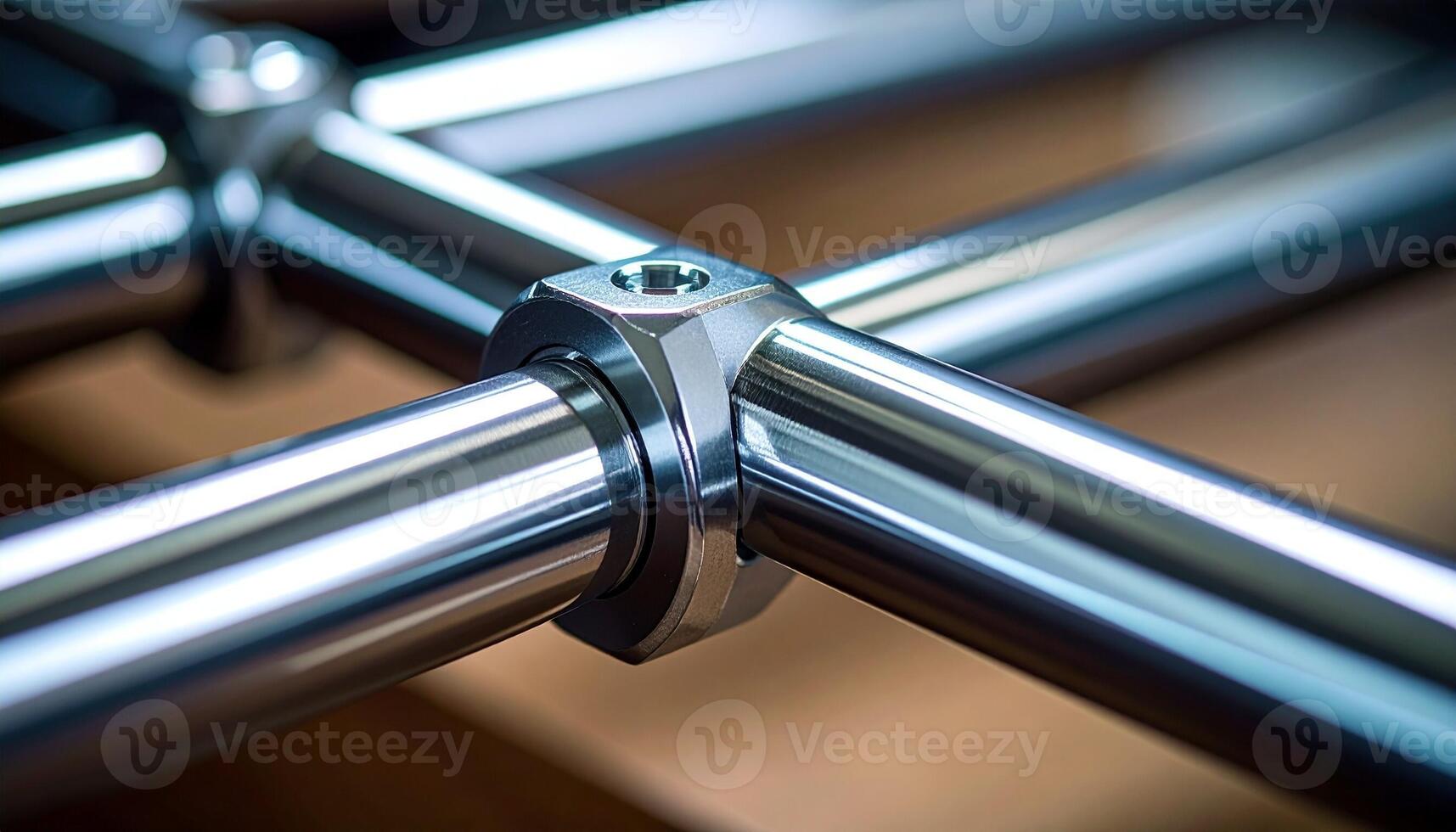 Close-up View of Metal Pipe Fittings Connected at a Joint in a Workshop Environment photo