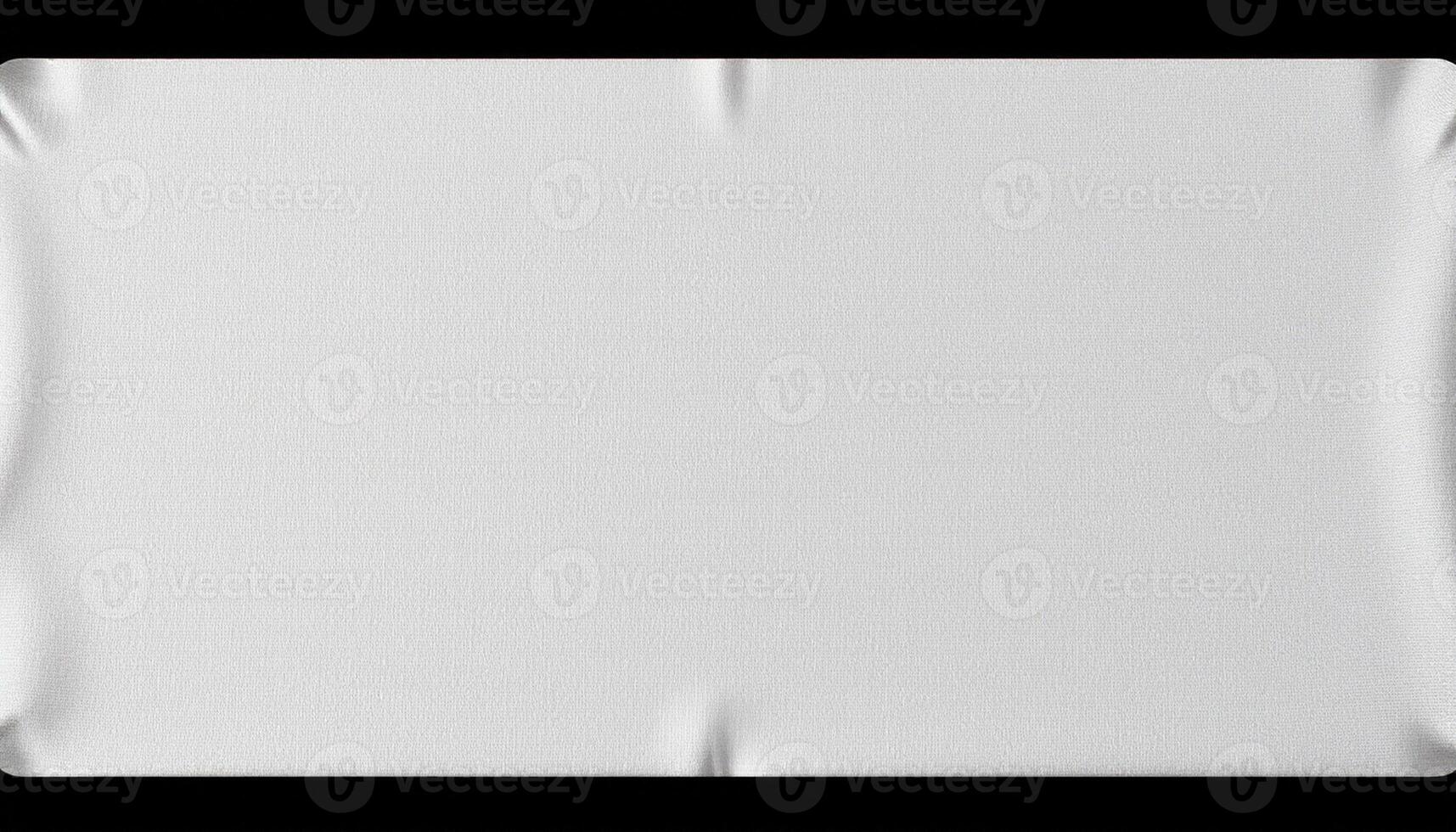 A white square cloth on a black surface photo