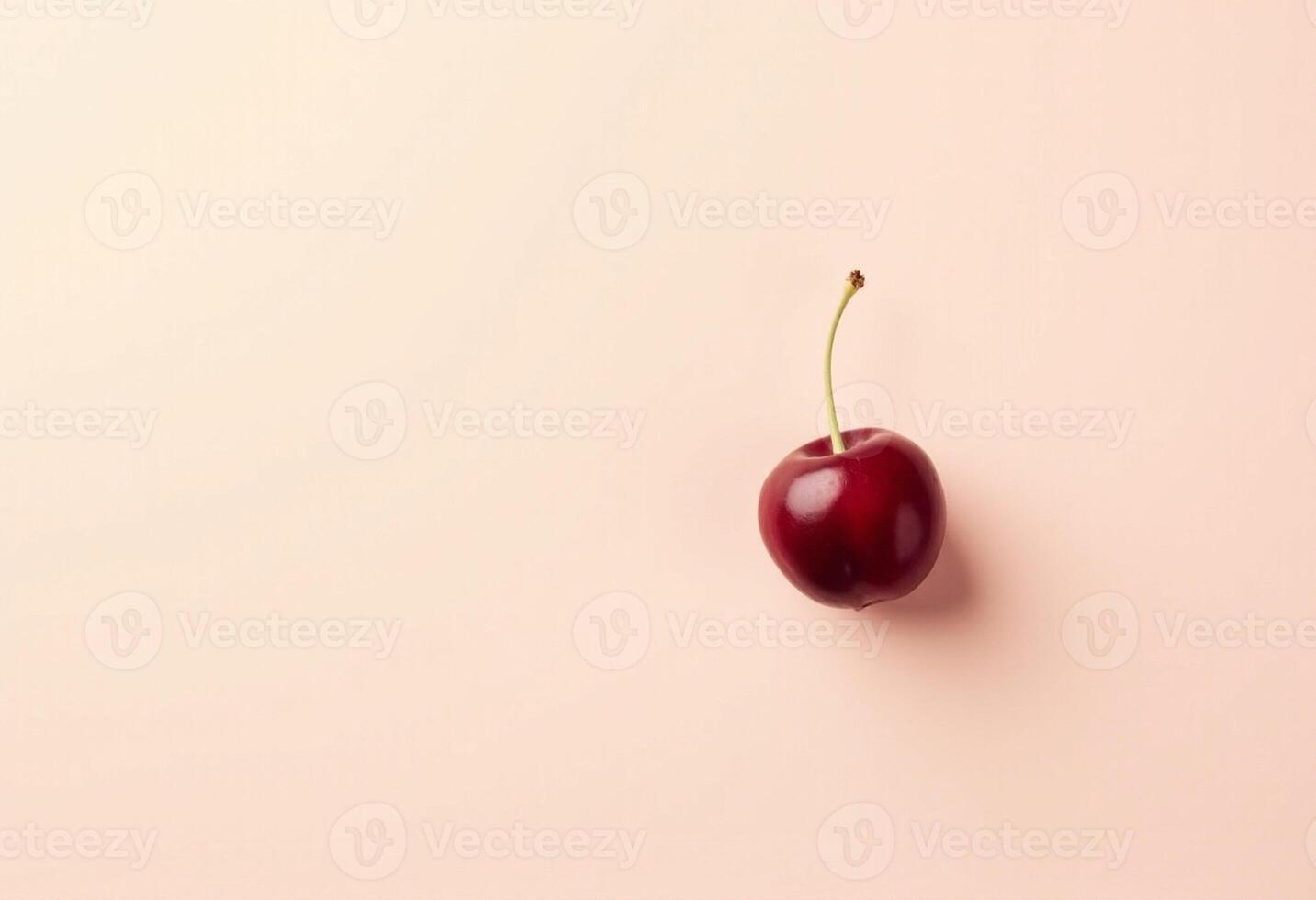 Single Red Cherry Fruit on Clean Backdrop photo