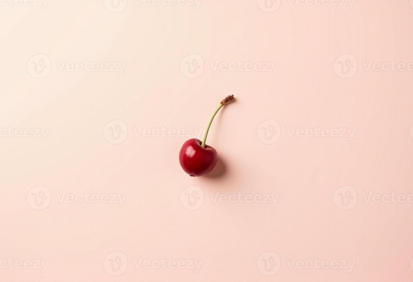 Cherry placed naturally on white backdrop with curved stem. photo