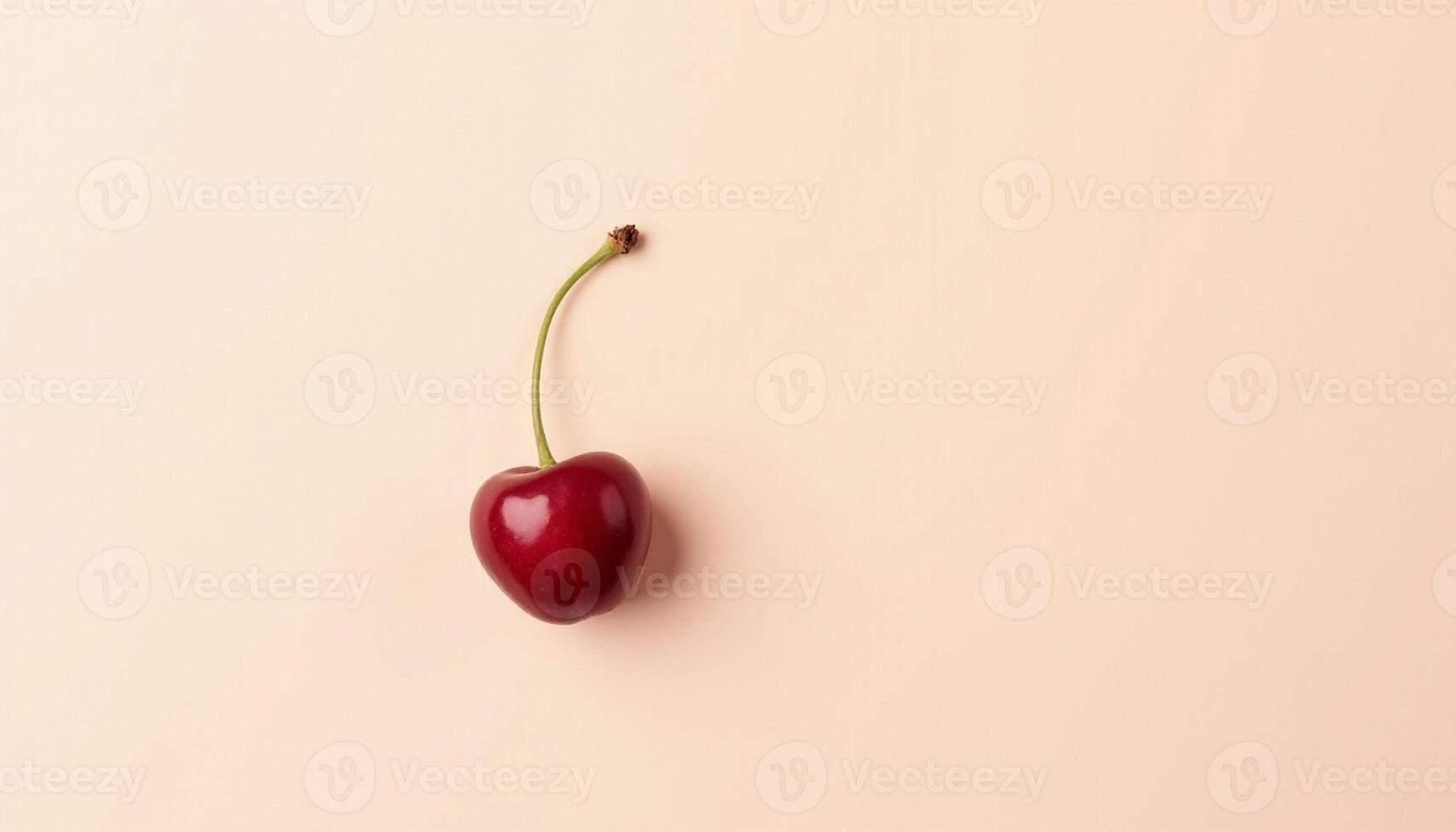Deep red cherry on textured pastel background, clean design. photo