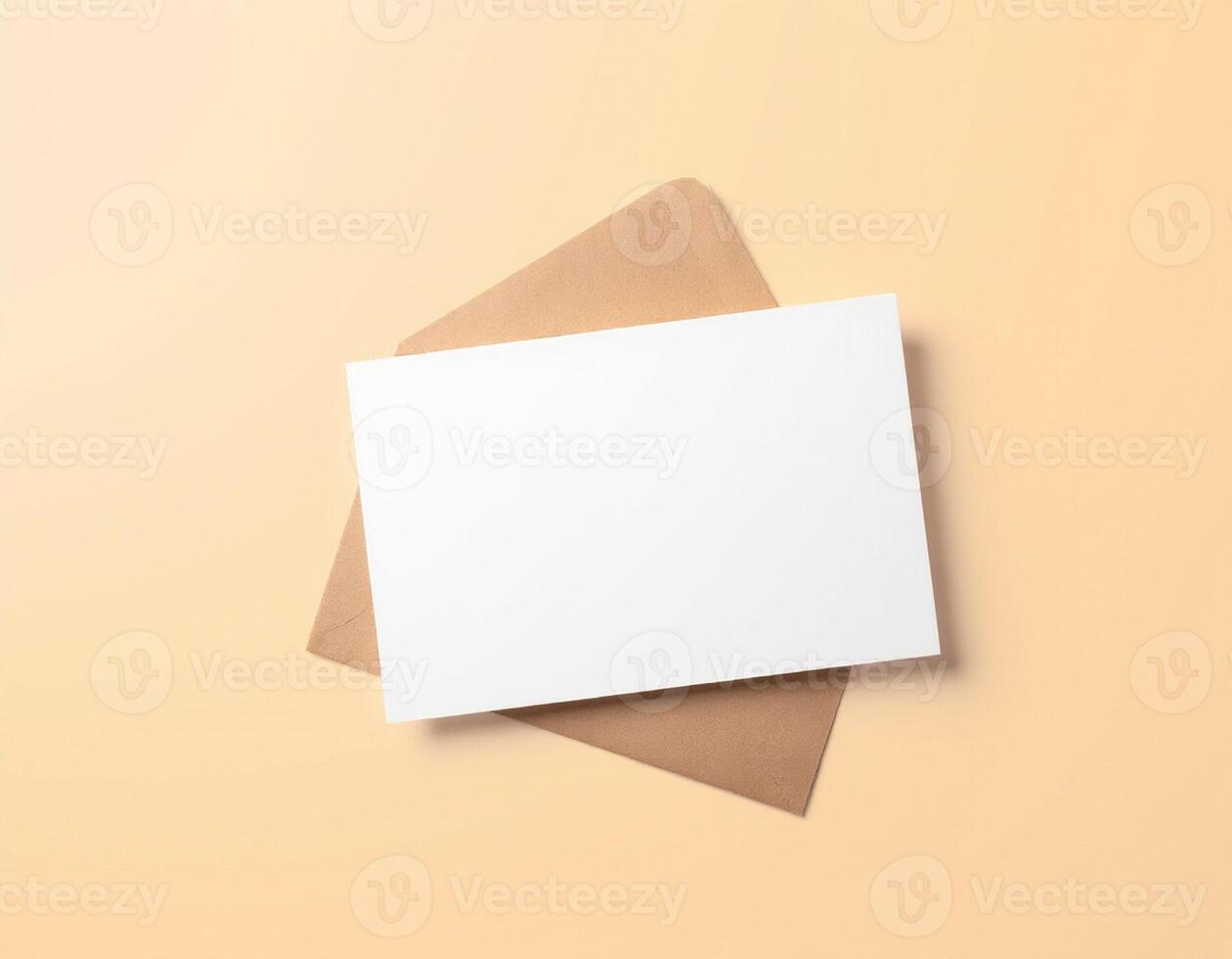 Blank white card on a brown paper background photo