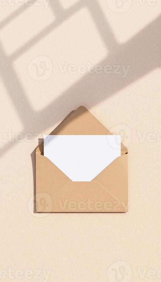 An open envelope with a blank paper on it photo