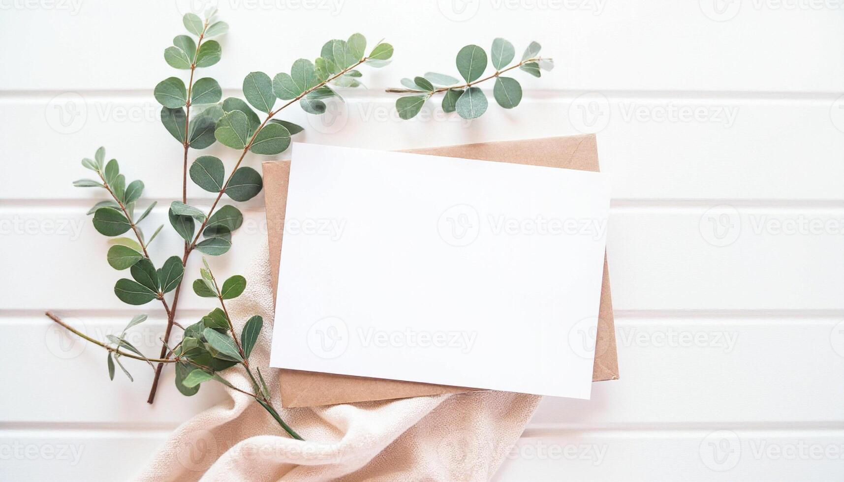 Blank card with eucalyptus leaves on white background photo