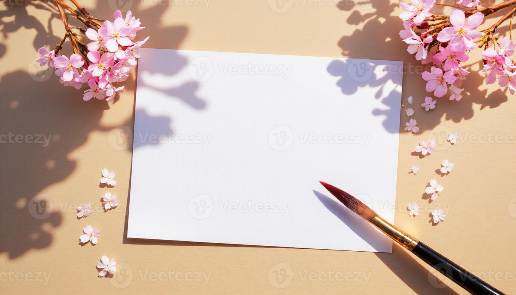 Blank paper, pen and cherry blossom on beige background photo