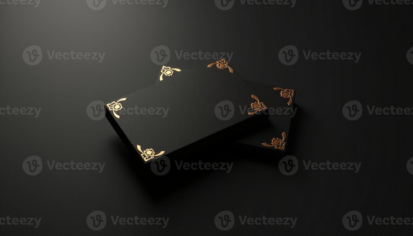 Black and gold business card mockup on black background photo