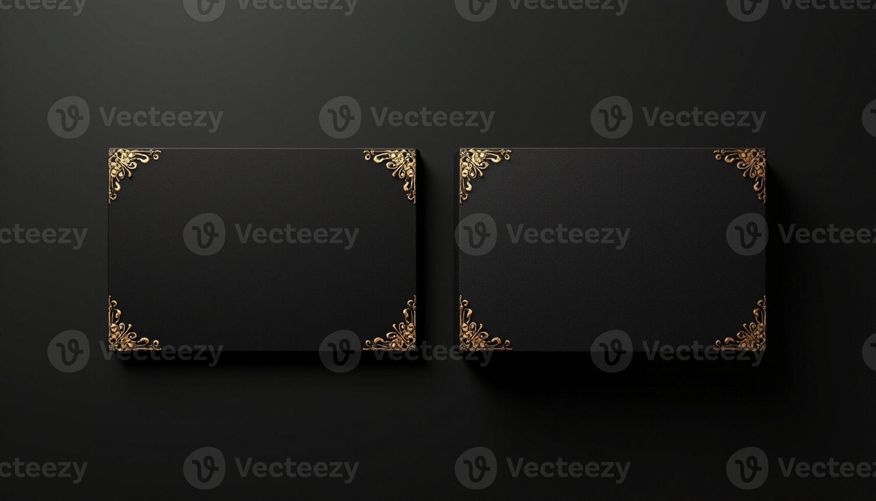 Two black square boxes with gold floral pattern on the black background photo