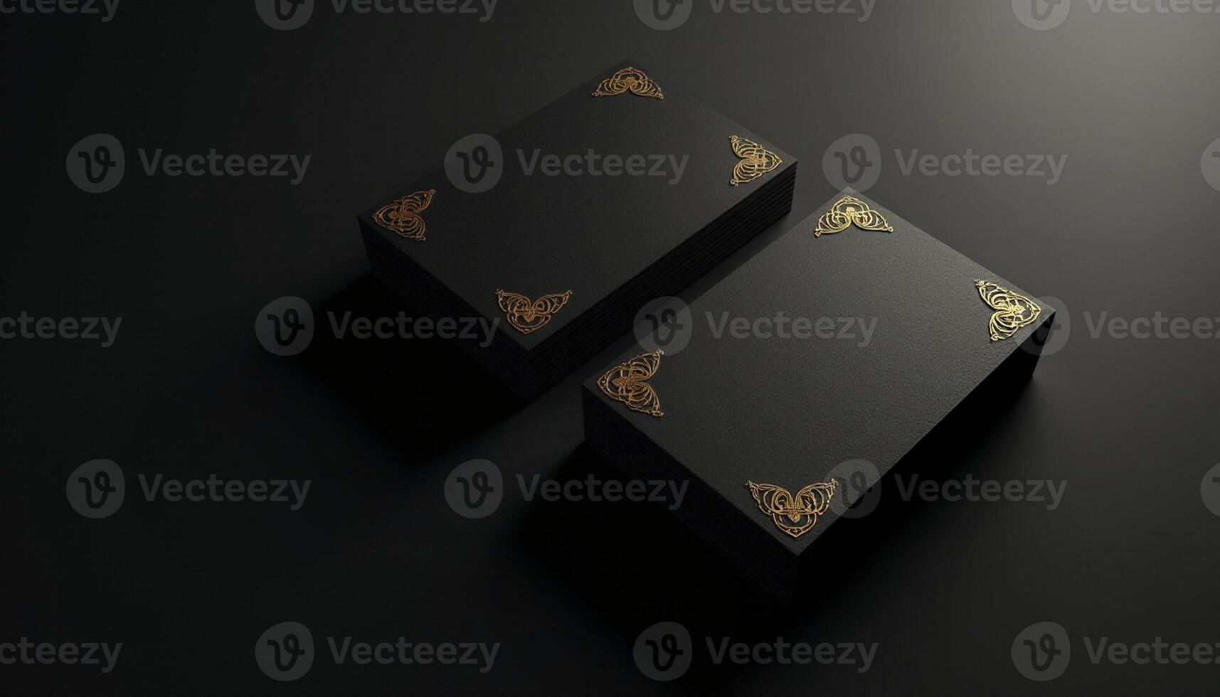 Two black boxes with gold butterflies on them photo