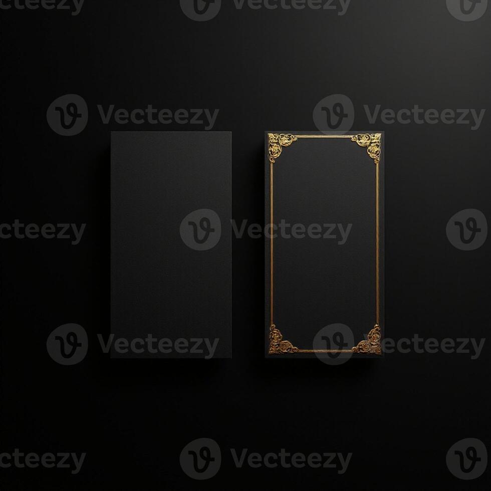 Two black boxes with gold frames on a black background photo