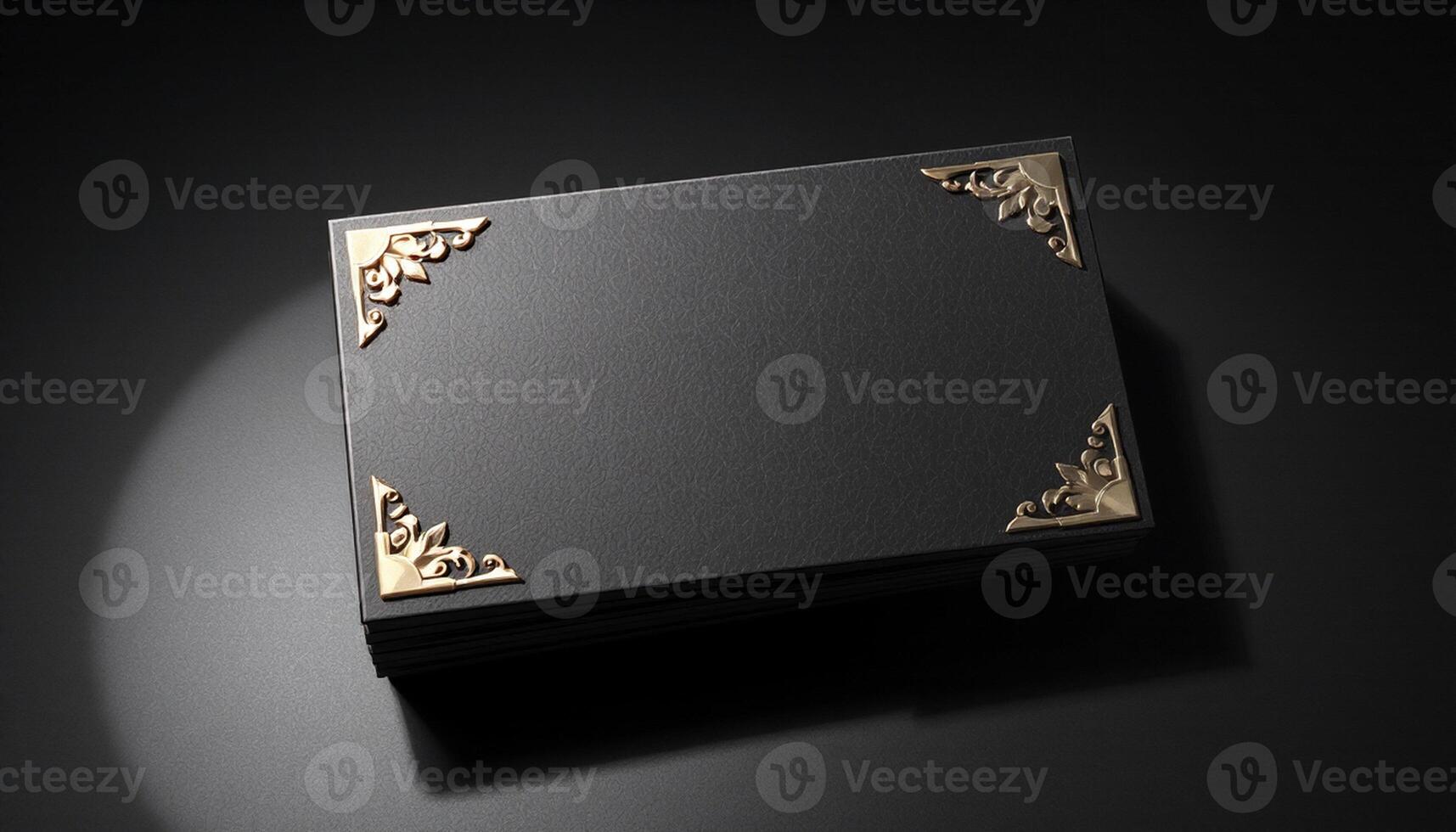 Black and gold card with gold frame on a black background photo