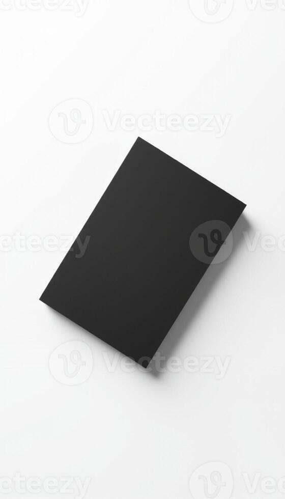 A black sheet of paper on a white surface photo
