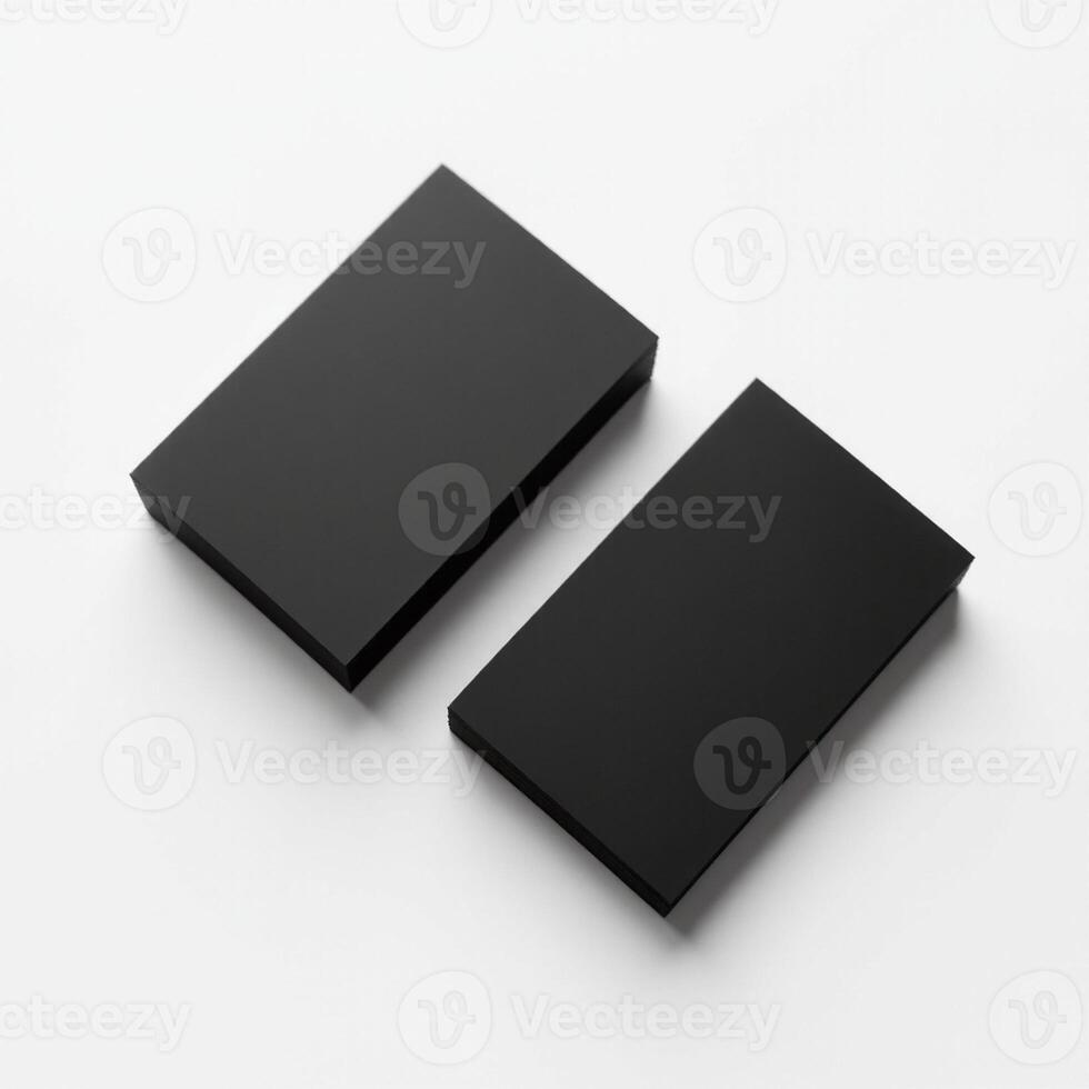 Two black boxes on a white surface photo