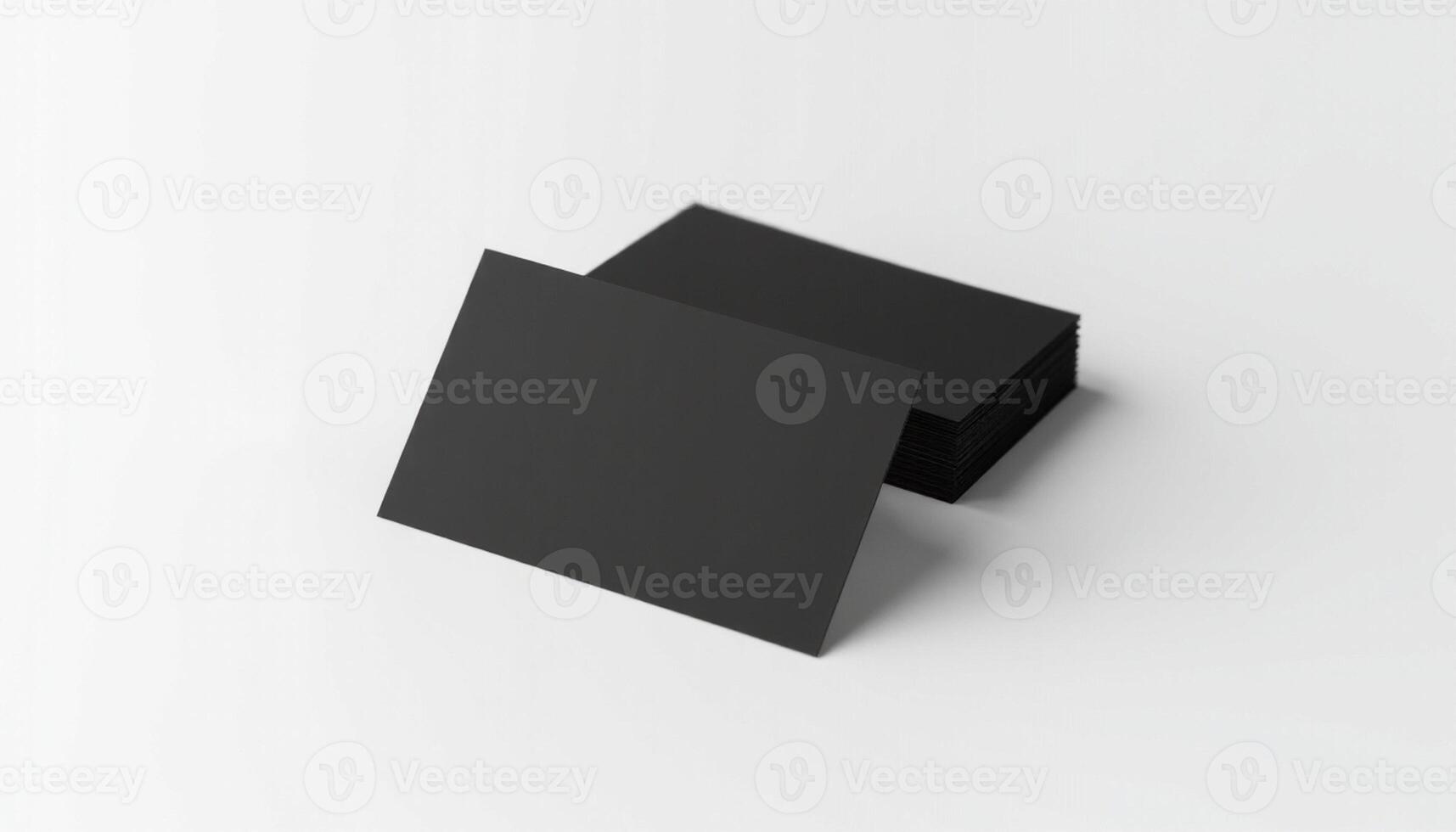 A black square card on a white surface photo