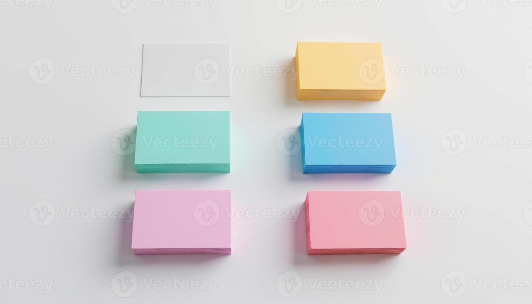 Four different colored sticky notes on a white surface photo