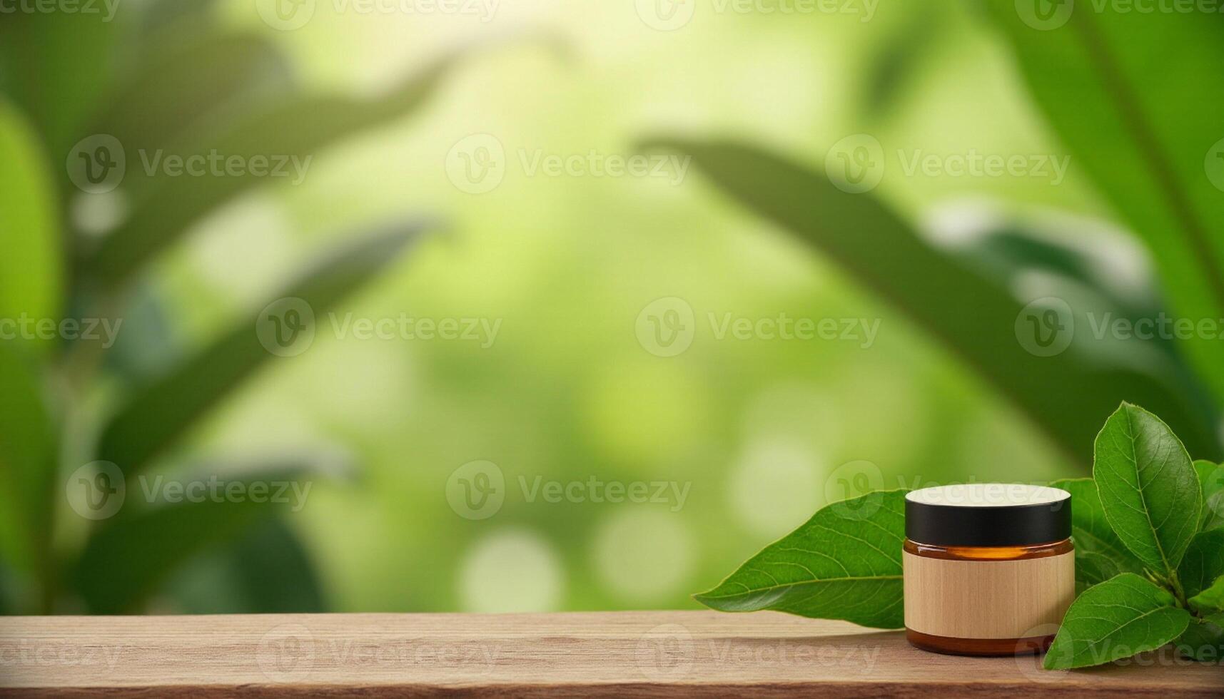 Bottle of natural essential oil on wooden table with green leaves on blurred background photo