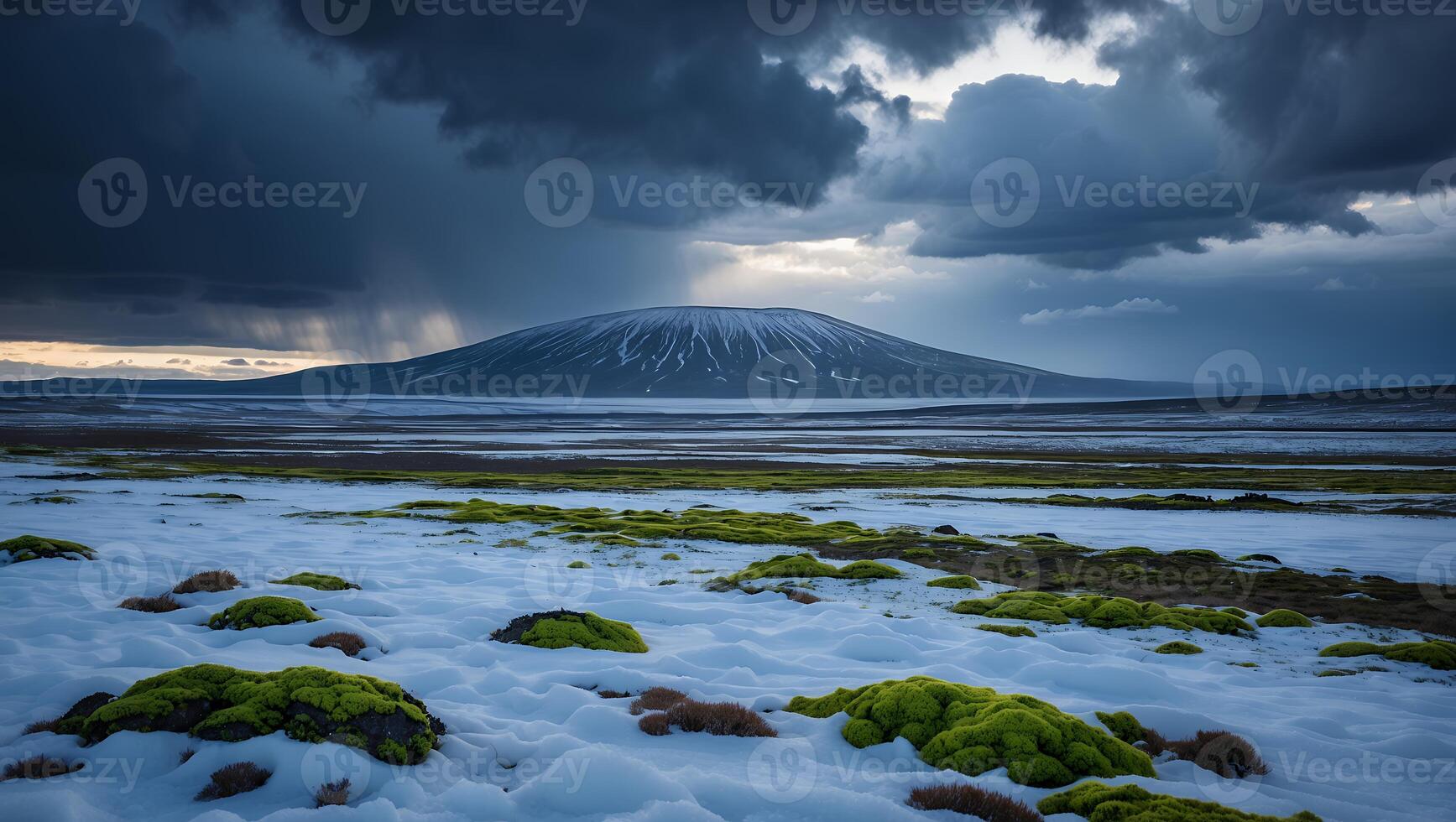 Snowy Landscape with Distant Mountain Under Dramatic Clouds and Rain photo