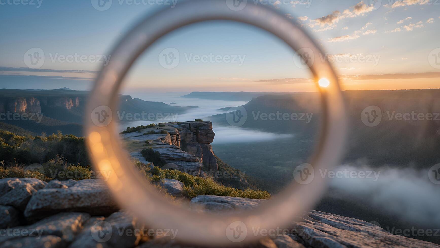 Viewing Distant Mountains Through a Ring at Sunrise Above Mist photo