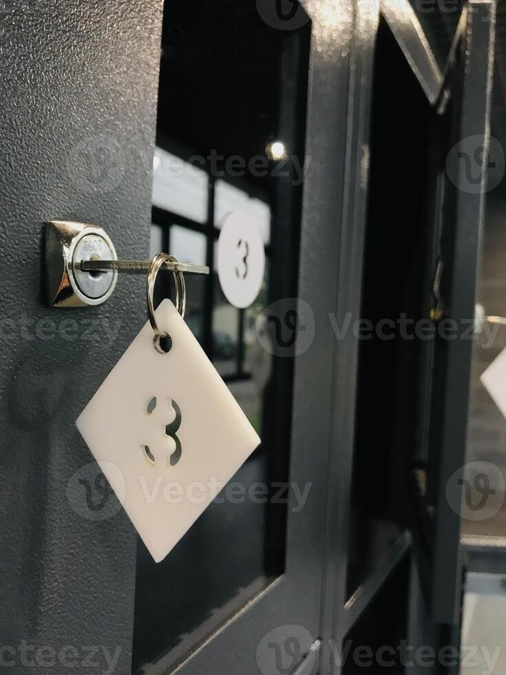 Locking mechanism with tag number three on a storage Cabinet photo