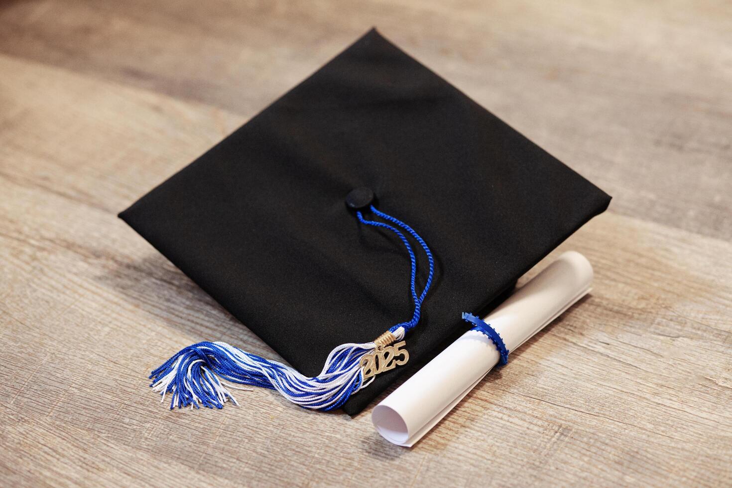 Graduation cap with diploma photo