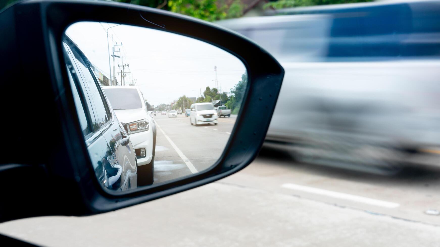 Inside view of mirrors wing. Clear traffic in rural areas view inside mirror wing. photo
