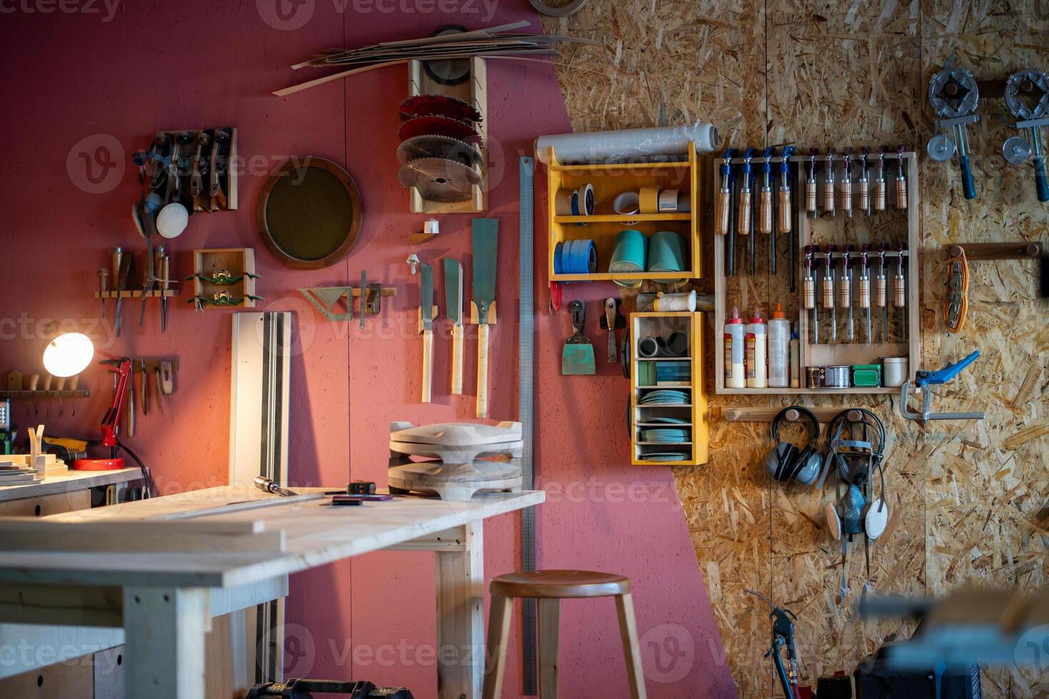 Professional carpenter workshop with tool cabinet and workbench for custom furniture creation photo