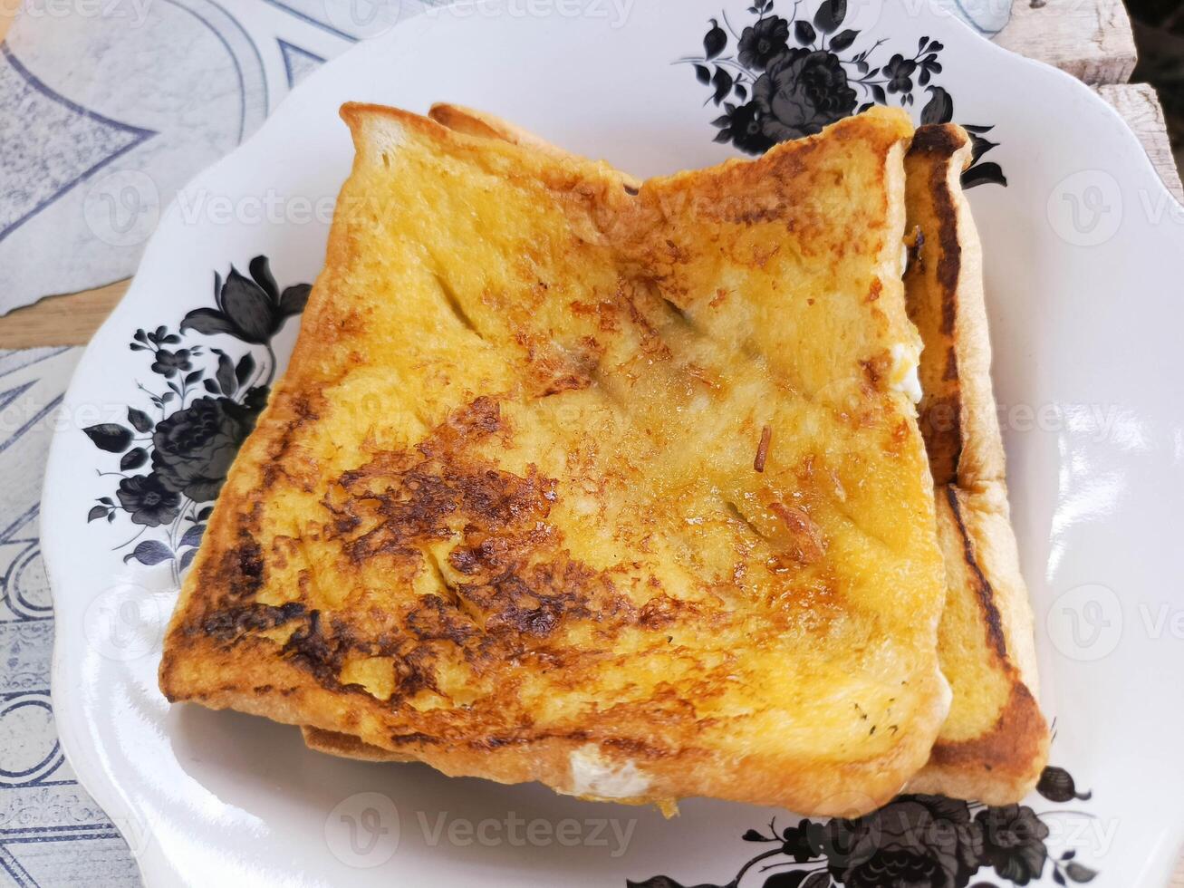 Golden French Toast on Floral Plate Breakfast Still Life photo