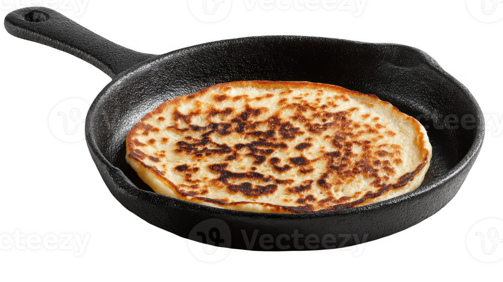 Deliciously browned pancake cooking in cast iron skillet on transparent background png