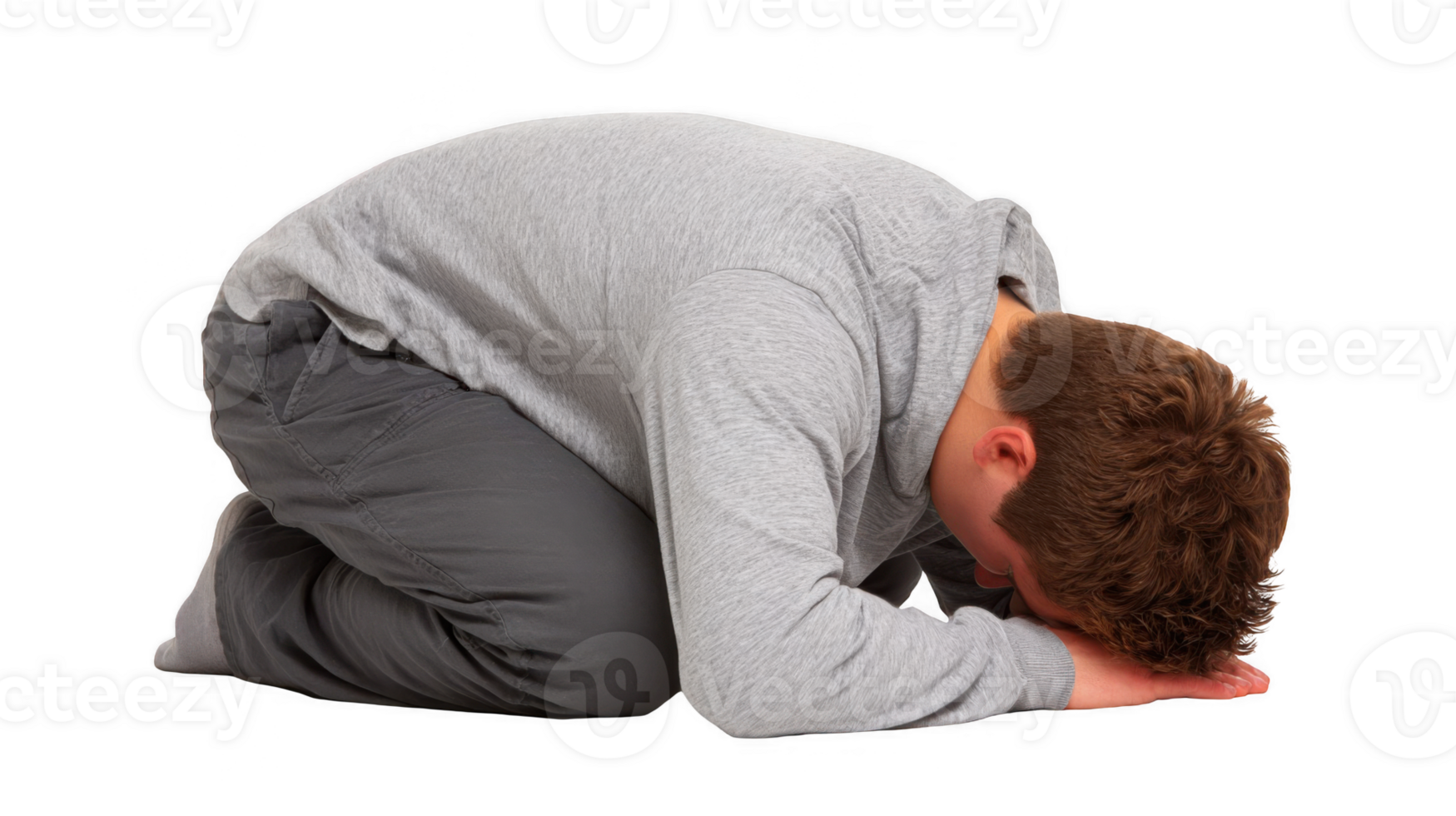 Young man kneeling with head down in despair on transparent background png