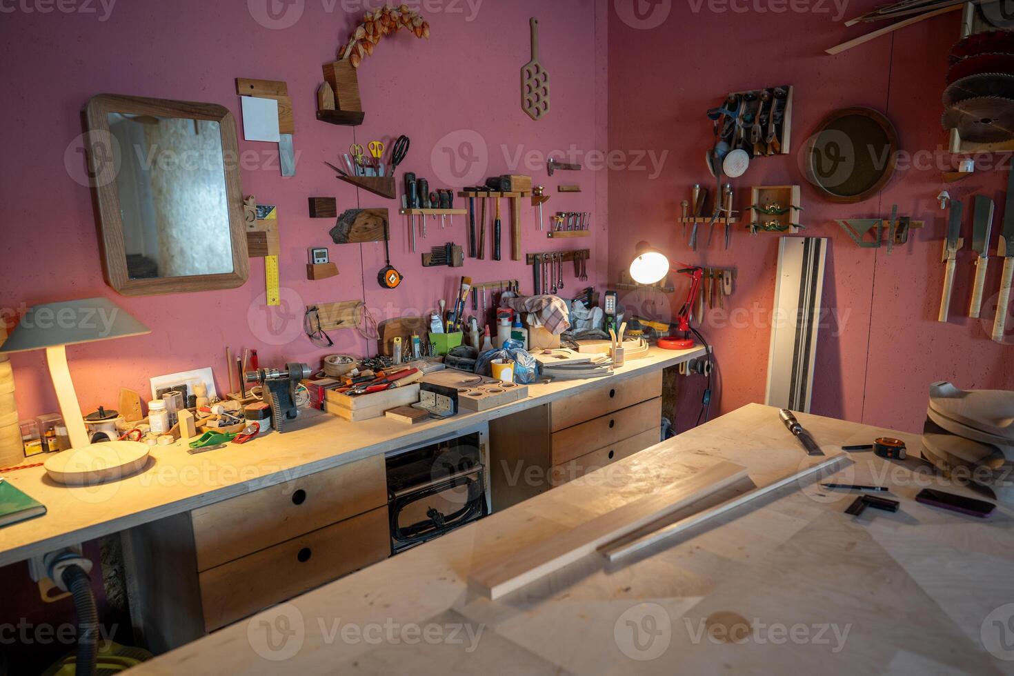 Woodworking studio with organized power tools and clean work surface at day start. Wall tool layout photo