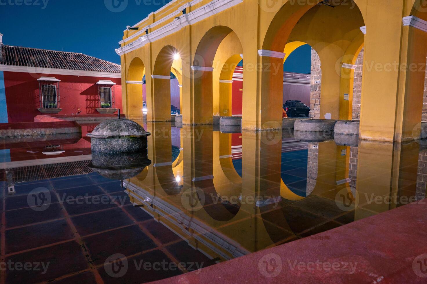 Colonil arches of Tanque La Union in Antigua Guatemala at night photo